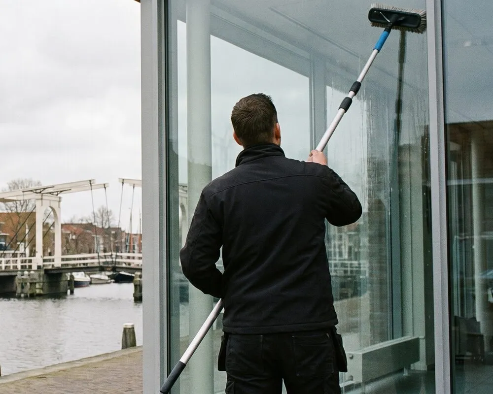 Window cleaner at work in Weesp